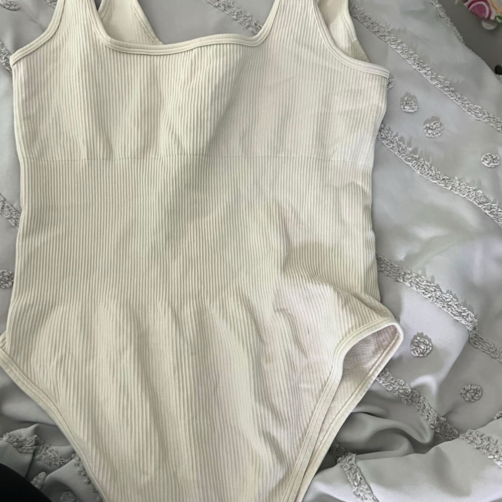 Cream Bodysuit with Scoop Neckline and Textured Fabric
